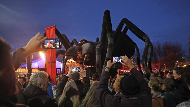 The Tasmanian cave spider shaped Ogoh-Ogoh is paraded through Morrison Street Picture: LUKE BOWDEN