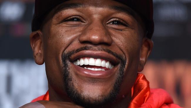 LAS VEGAS, NV - APRIL 29: WBC/WBA welterweight champion Floyd Mayweather Jr. laughs during a news conference at the KA Theatre at MGM Grand Hotel & Casino on April 29, 2015 in Las Vegas, Nevada. Mayweather will face WBO welterweight champion Manny Pacquiao in a unification bout on May 2, 2015 in Las Vegas. (Photo by Ethan Miller/Getty Images)