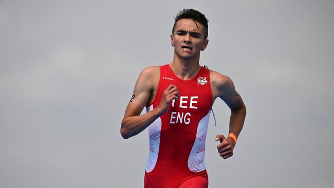 England's Alex Yee competes to win and take the gold medal in the Men's Individual Sprint Distance Triathlon event on day one of the Commonwealth Games at Sutton Park in Sutton Coldfield, central England, on July 29, 2022. (Photo by Ben Stansall / AFP)