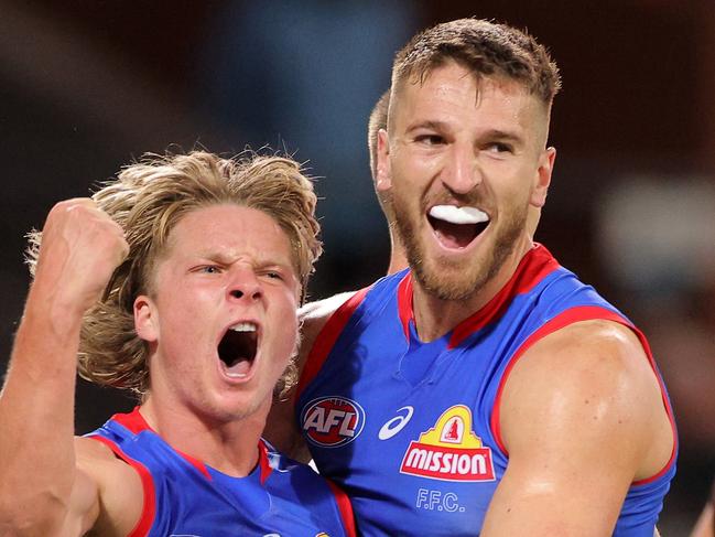 ADELAIDE, AUSTRALIA - MAY 15: Cody Weightman of the Bulldogs celebrates with Marcus Bontempelli of the Bulldogs after kicking a goal during the round 9 AFL match between the Port Adelaide Power and the Western Bulldogs at Adelaide Oval on May 15, 2021 in Adelaide, Australia. (Photo by Daniel Kalisz/Getty Images)