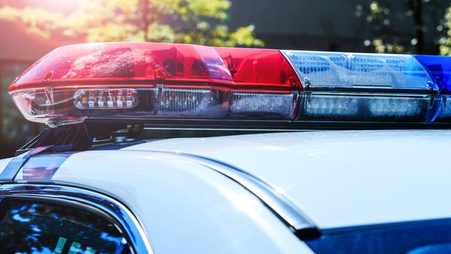 Police force department in full activity. Red light flasher of a patrol police car at sunday. Day patrolling of the city with lights flashers turned off. Security siren of the Canadian police vehicle.