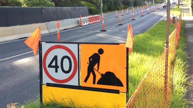 Motorists have to navigate a narrow thoroughfare between traffic cones at 40km/h.