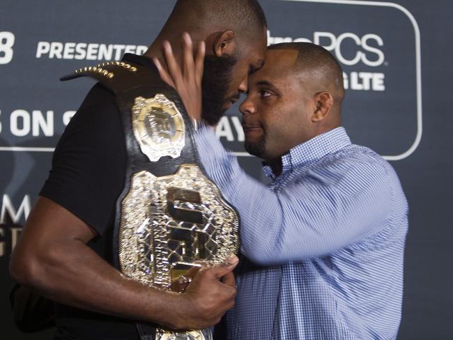 Daniel Cormier, right, prepares to shove UFC light heavyweight champion Jon Jones.