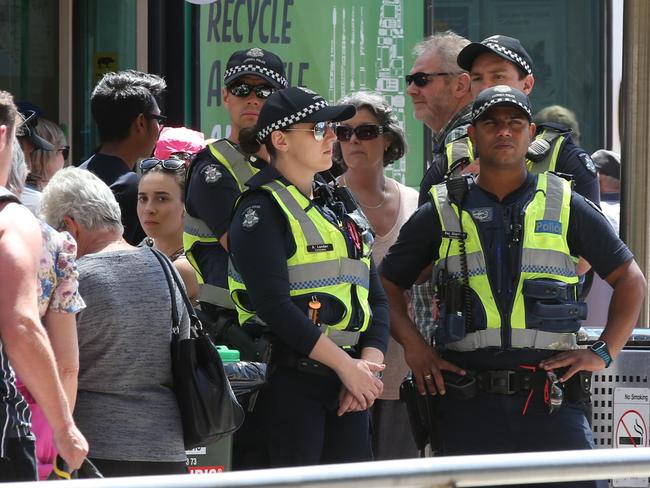 Homeless camp in Flinders St. Police keep watch from a distance. Thursday, Jan 19. 2017. Picture: David Crosling