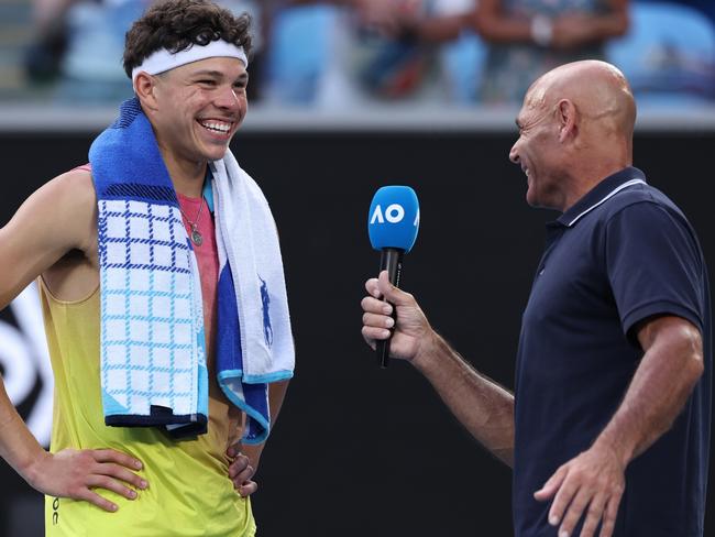 MELBOURNE, AUSTRALIA - JANUARY 20: Ben Shelton of the United States smiles as he is interviewed by Roger Rasheed following victory over Gael Monfils of France after he retired in the Men's Singles Fourth Round match during day nine of the 2025 Australian Open at Melbourne Park on January 20, 2025 in Melbourne, Australia. (Photo by Cameron Spencer/Getty Images)