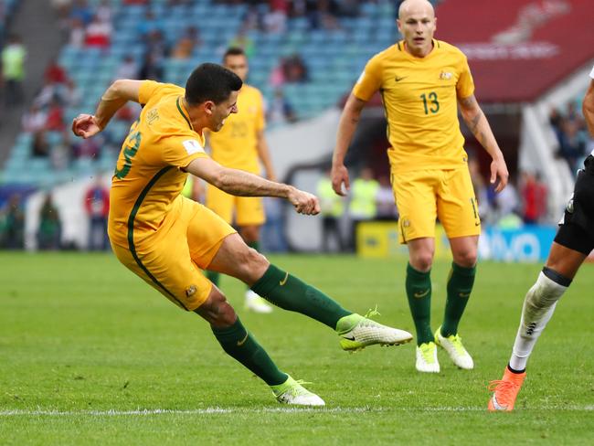 Tommy Rogic of Australia scores.