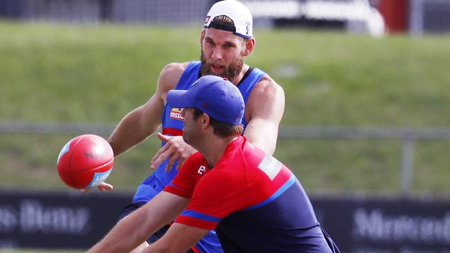 Jackson Trengrove squeezes a kick past assistant coach Joel Corey. Picture: Michael Klein