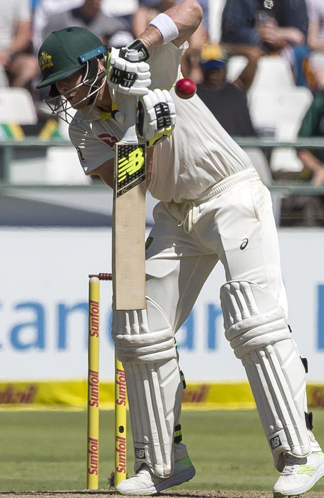 Steve Smith awkwardly deals with a short ball.