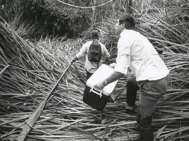 Crocodile Research officer Brett Ottley leads Patrick Markwick-Smith in the Melacca Swamp to capture crocodile eggs for research in 1993. Picture: News Corp Australia