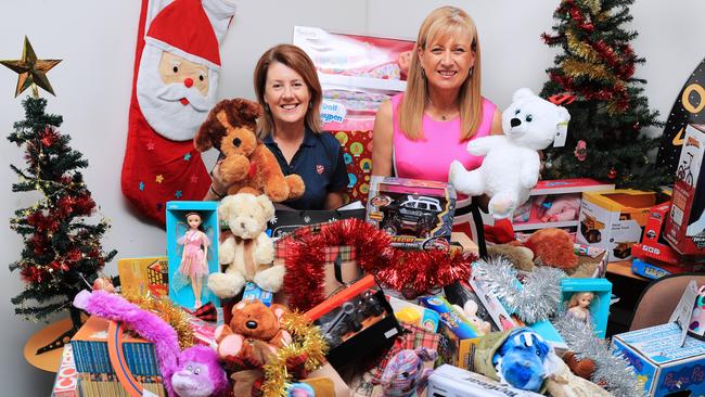 Salvation Army Officer Leanne Elsley joins Federal Member for Richmond Justine Elliot with more than donated 400 toys that which will distributed to needy children by the Salvos before Christmas. Picture: Scott Powick.