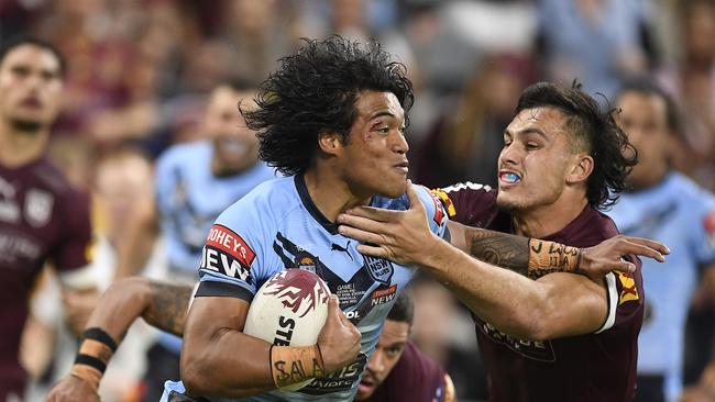 Brian To'o on the charge for the Blues in the State of Origin series opener. Picture: Ian Hitchcock/Getty Images