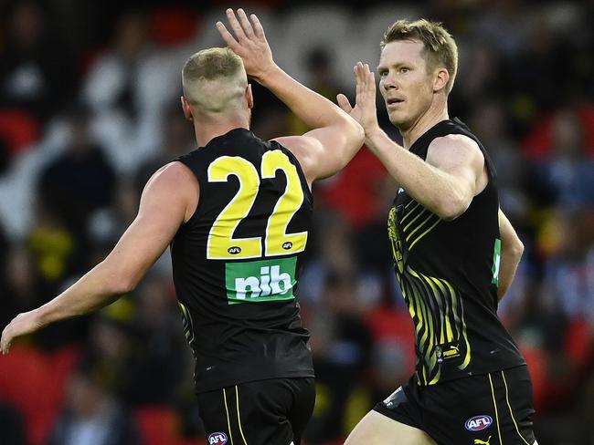 MELBOURNE, AUSTRALIA - MARCH 05: Jack Riewoldt of the Tigers is congratulated by team mates after kicking a goal during the AFL Community Series match between the Collingwood Magpies and the Richmond Tigers at Marvel Stadium on March 05, 2021 in Melbourne, Australia. (Photo by Quinn Rooney/Getty Images)