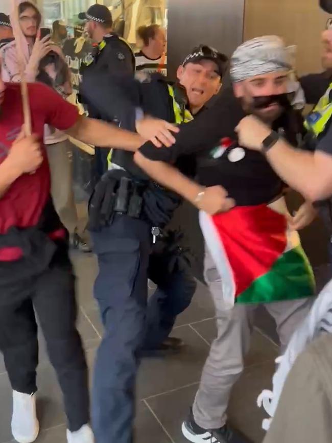 Police and protesters clash outside David Jones. Picture: Fergus Ellis