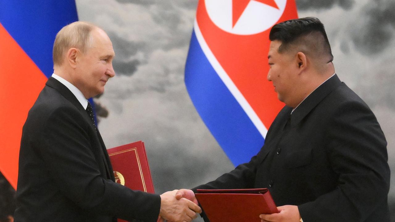 Russian President Vladimir Putin shakes hands with North Korea's leader Kim Jong-un after a signing ceremony following their bilateral talks at Kumsusan state residence in Pyongyang. (Photo by Kristina Kormilitsyna / POOL / AFP)