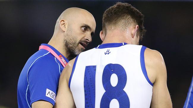 Rhyce Shaw talks with Shaun Atley during North Melbourne’s win over Richmond. Picture: Michael Klein.