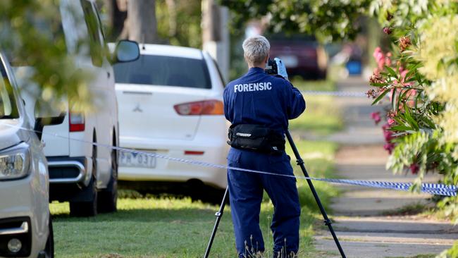 A forensic officer takes photos in Liberty Parade. Picture: Andrew Henshaw