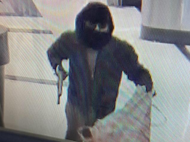 A MAN wielding a shotgun and wearing thongs has robbed a jewellery store at Arndale Shopping Centre during a brazen lunchtime smash and grab. Holding a shotgun and big sack, the balaclava-wearing man entered the jewellery store at the shopping centre in Adelaide’s northwest at about 12.45pm. He proceeded to smash display cases with a hammer and steal their contents before fleeing out the store’s western exit. Pic: SAPOL