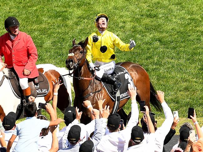 MELBOURNE, AUSTRALIA - NOVEMBER 07: Mark Zahra riding Without A Fight celebrates winning Race 7, the Lexus Melbourne Cup during Melbourne Cup Day at Flemington Racecourse on November 07, 2023 in Melbourne, Australia. (Photo by Josh Chadwick/Getty Images)