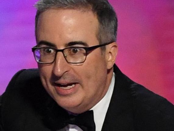 British-US comedian John Oliver accepts the Outstanding Scripted Variety Series award for âLast Week Tonight with John Oliverâ onstage during the 76th Emmy Awards at the Peacock Theatre at L.A. Live in Los Angeles on September 15, 2024. (Photo by VALERIE MACON / AFP)