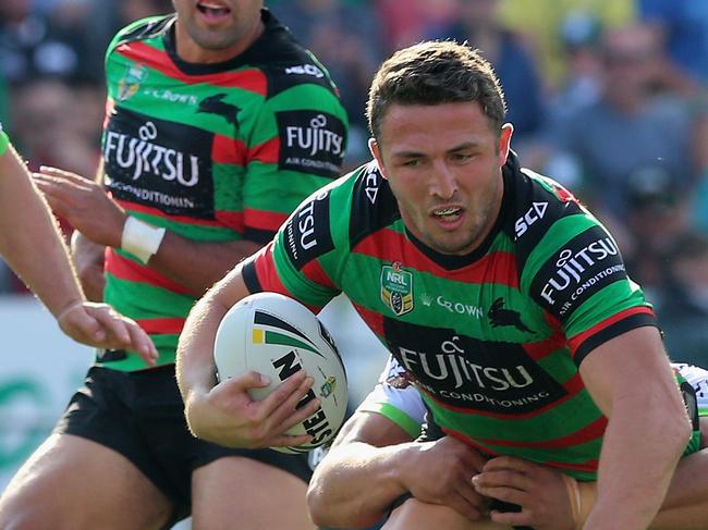 GOSFORD, AUSTRALIA - APRIL 21:  Sam Burgess of the Rabbitohs is tackled by the Raiders defence during the round seven NRL match between the South Sydney Rabbitohs and the Canberra Raiders  at Central Coast Stadium on April 21, 2018 in Gosford, Australia.  (Photo by Ashley Feder/Getty Images)