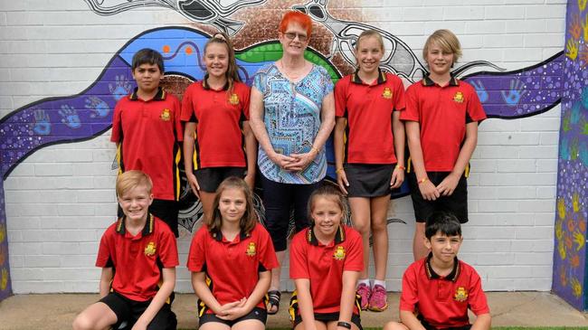 LOVED EDUCATOR: Kath Scotney with Bundaberg North State School Students David Baxter, Mia Godischkie, Bella-Rose Johnson, Jamie Spletter, Tyson Rickard, Nephiteri Brown, Sarah Wake and Cameron Raines. Picture: Geordi Offord