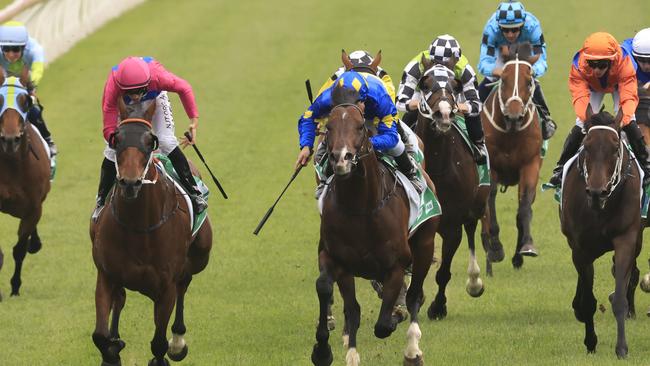 Jay Ford and Archedemus (cerise) combine to win The Gong. Picture: Getty Images