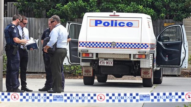 Police outside the unit complex where the body of Kym Mitchell was found stuffed in a wheelie bin in November 2018.