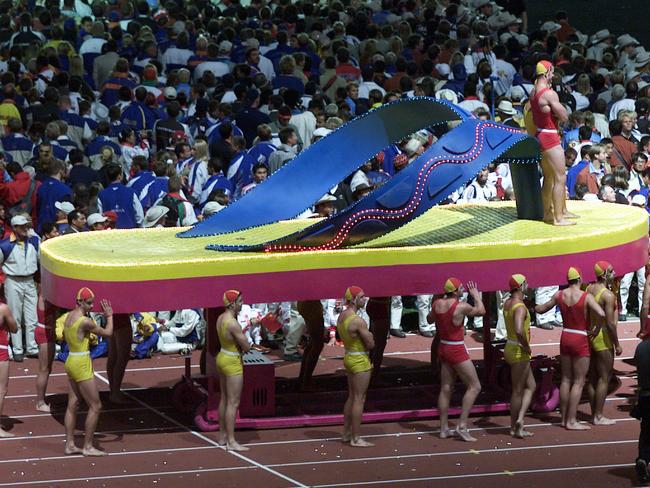 Surf lifesavers carrying a giant thong as part of the 2000 Closing Ceremony.