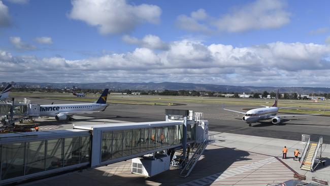 An accused drug trafficker was allegedly found by police at Adelaide Airport, trying to flee the state.