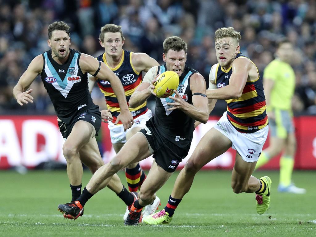 Brad Ebert under pressure from Hugh Greenwood with Travis Boak and Matt Crouch running support. Picture: Sarah Reed