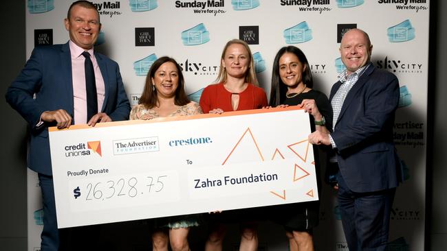 A cheque for the Zahra Foundation. Picture: Naomi Jellicoe