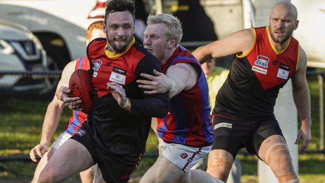 SFNL: Dingley’s Justin Van Unen can’t escape the tackler. Picture: Valeriu Campan