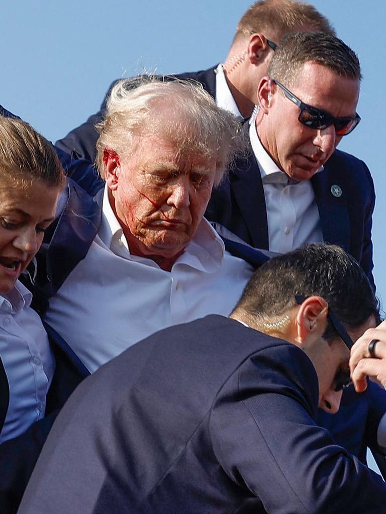 Donald Trump is rushed off stage after being grazed by a bullet during a rally in Butler, Pennsylvania. Picture: Getty Images via AFP