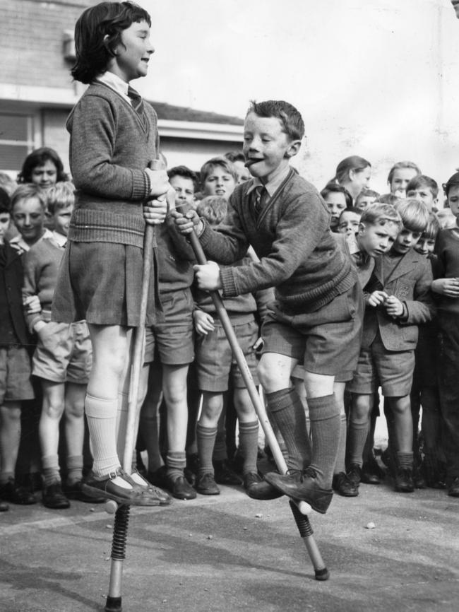 Kids keep warm during lunch at Mitcham Primary School, 1963, on pogo sticks.