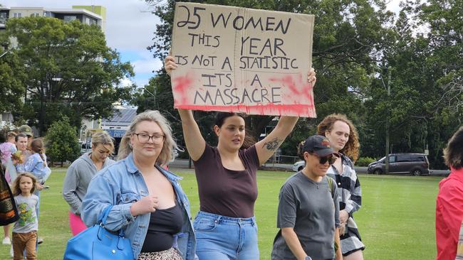 More than 100 people marched in the No More Violence Rally in Toowoomba's Queens Park, organised by volunteer group What Were You Wearing to advocate for more funding to stop domestic and family violence.