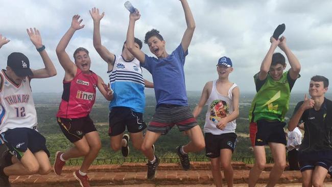 Norwest Sydney Bluetongues players celebrate after climbing Sirigiya. Picture: Joanne Smith