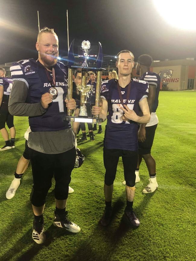 Coast gridiron stars Brad Ebdon and Warwick Russell celebrate the Bayside Ravens winning the Sunbowl last year.