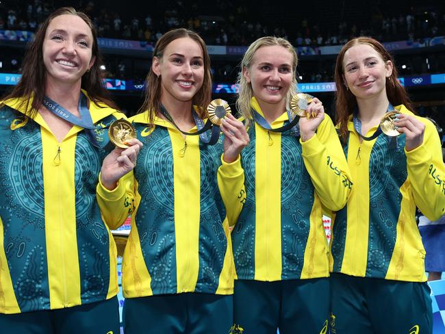 Lani Pallister, Brianna Throssell, Ariarne Titmus and Mollie O’Callaghan show off their gold medals. Picture: Adam Head