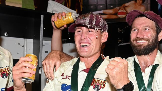 BRISBANE, AUSTRALIA – APRIL 18: Marnus Labuschagne and Michael Neser of Queensland celebrate victory during day four of the Sheffield Shield Final match between Queensland and New South Wales at Allan Border Field on April 18, 2021 in Brisbane, Australia. (Photo by Bradley Kanaris/Getty Images)