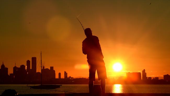 A man fishing at Williamstown on The Queens birthday public holiday. Picture: Nicole Garmston