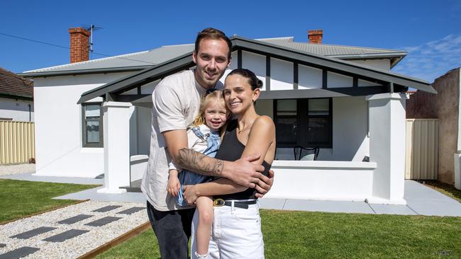 Kellie and Jeremy Finlayson with their daughter Sophia, 3, in their Hendon home that they sold. Picture: Mark Brake