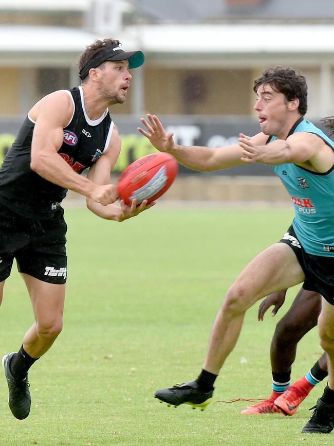 Former captain Travis Boak fires off a handpass at Port Adelaide training at Alberton. Picture: Naomi Jellicoe