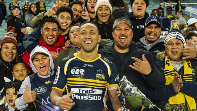 Christian Lealiifano of the Brumbies poses for a portrait with his family.