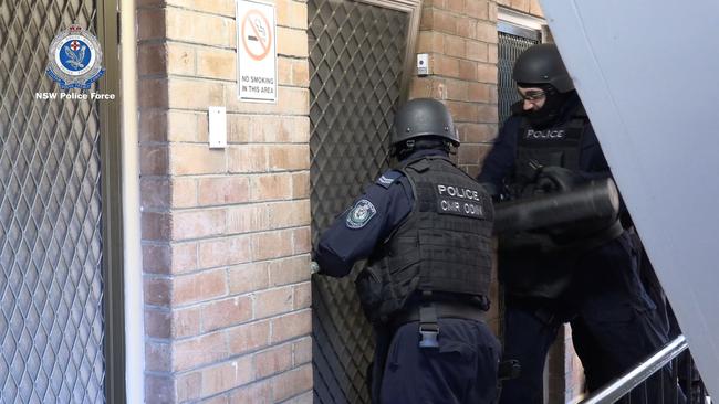 Police raid a home during the operation. Picture: NSW Police