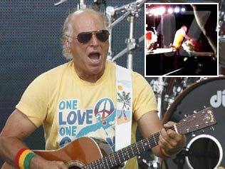 Jimmy Buffet performing. Pic: AP Inset: TMZ's footage of the singer falling off stage