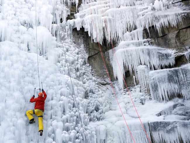 A man climbs up an artificial ice wall in Liberec, Czech Republic, Thursday, March 1, 2018. Central Europe has been hit by unusually freezing weather in recent days. Picture: AP
