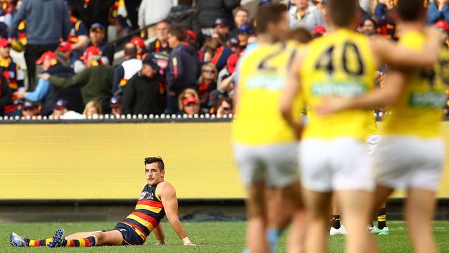 Crows captain Taylor Walker watches Richmond players celebrate on the siren of the grand final. Picture: Mark Kolbe/AFL Media/Getty Images