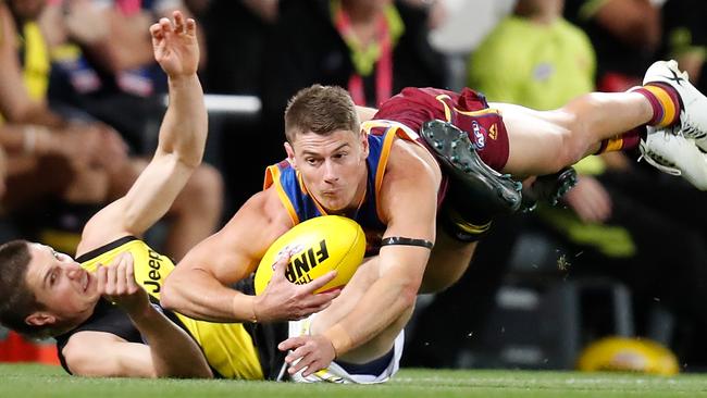 Brisbane captain Dayne Zorko shows his desire for the contest against Richmond’s Liam Baker in the qualifying final at the Gabba. Picture: Getty Images