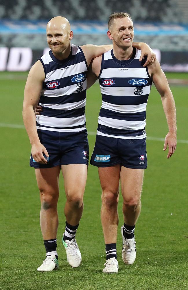 Gary Ablett and Joel Selwood of the Cats walk off after their 350 and 300th games respectively. Pic: Michael Klein