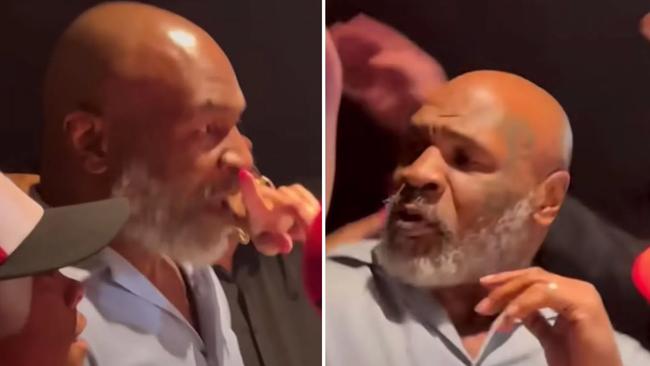 A female fan got right up in Mike Tyson’s face during a photo. Picture: FightHype.com